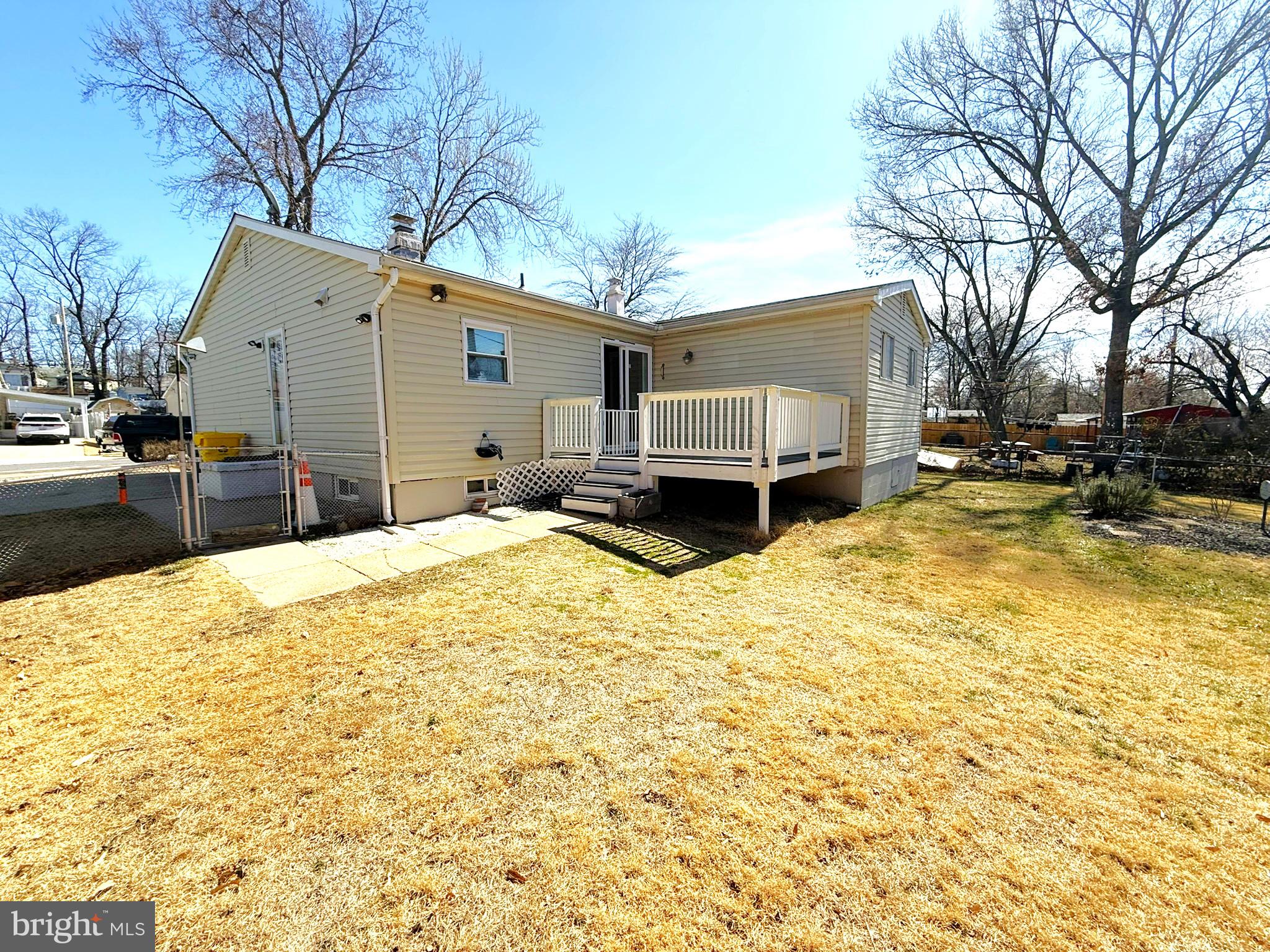 240 Federalsburg South Laurel, MD 20724 - Photo 4 of 36 a blue swimming pool with a bench and trees