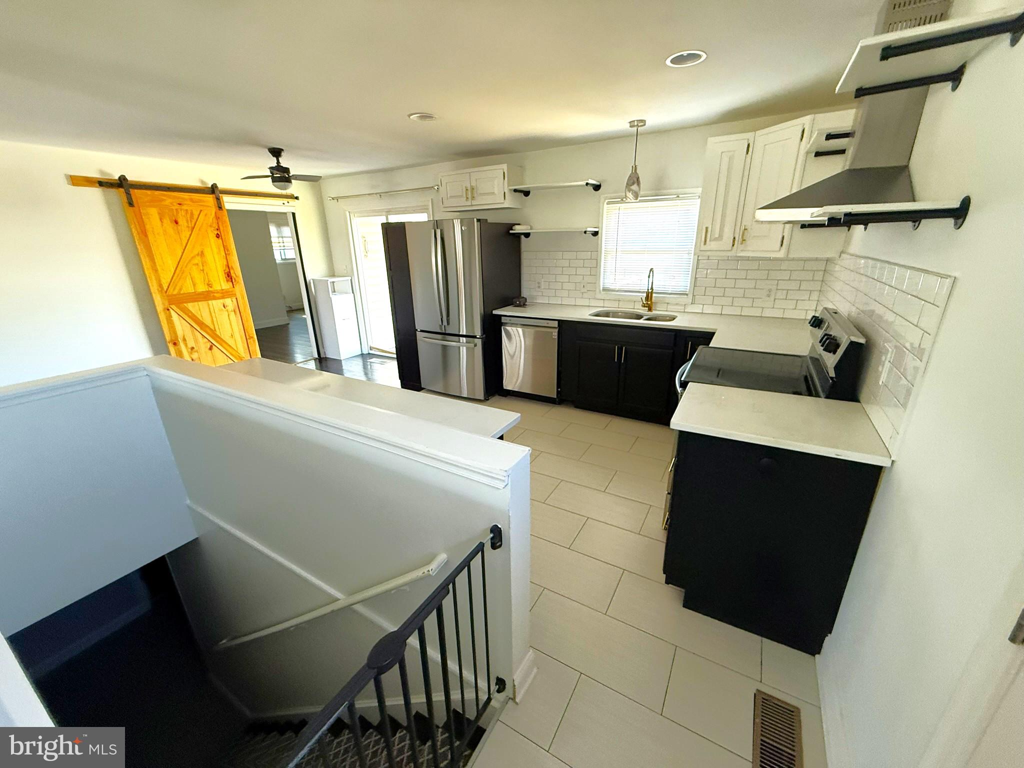 240 Federalsburg South Laurel, MD 20724 - Photo 10 of 36 a kitchen with stainless steel appliances a refrigerator and a stove top oven