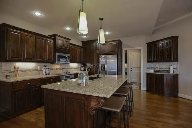 $585,000 | 1696 Northeast Parkwood Drive, Lee's Summit, MO 64064