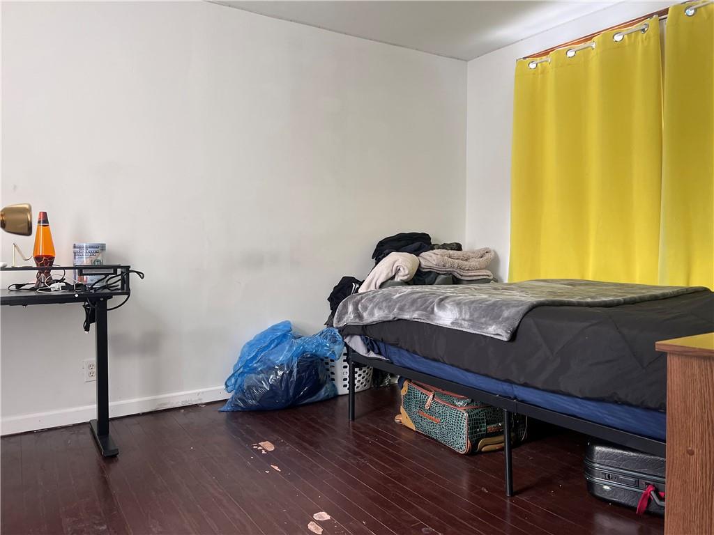 61 Pointview Road Pittsburgh, PA 15227 - Photo 11 of 12 a bedroom with a bed and wooden floor