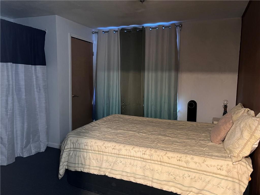 61 Pointview Road Pittsburgh, PA 15227 - Photo 5 of 12 a bedroom with a bed and a window