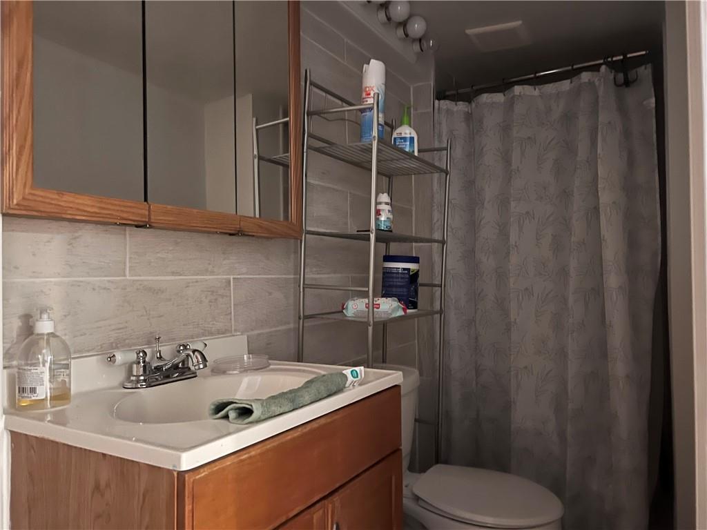 61 Pointview Road Pittsburgh, PA 15227 - Photo 7 of 12 a bathroom with a sink toilet and shower