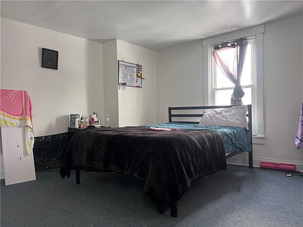 61 Pointview Road Pittsburgh, PA 15227 - Photo 10 of 12 a bedroom with a bed and window