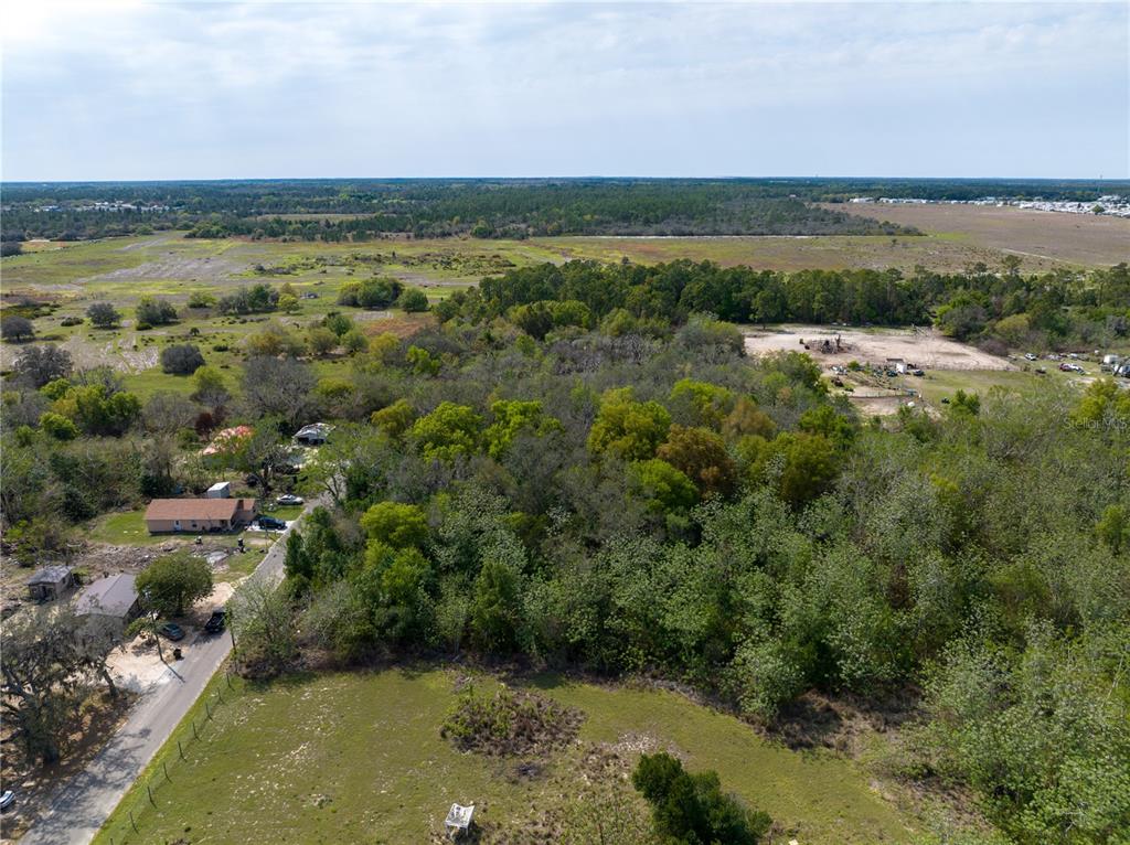 0 Tom Sheffield Road Frostproof, FL 33843 - Photo 11 of 23 a view of a lake with houses in the back