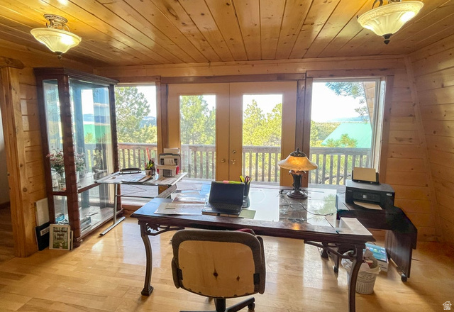 2498 West Silverado Ridge Alton, UT 84710 - Photo 6 of 51 Office area with french doors, wood finished floors, wooden ceiling, and wood walls