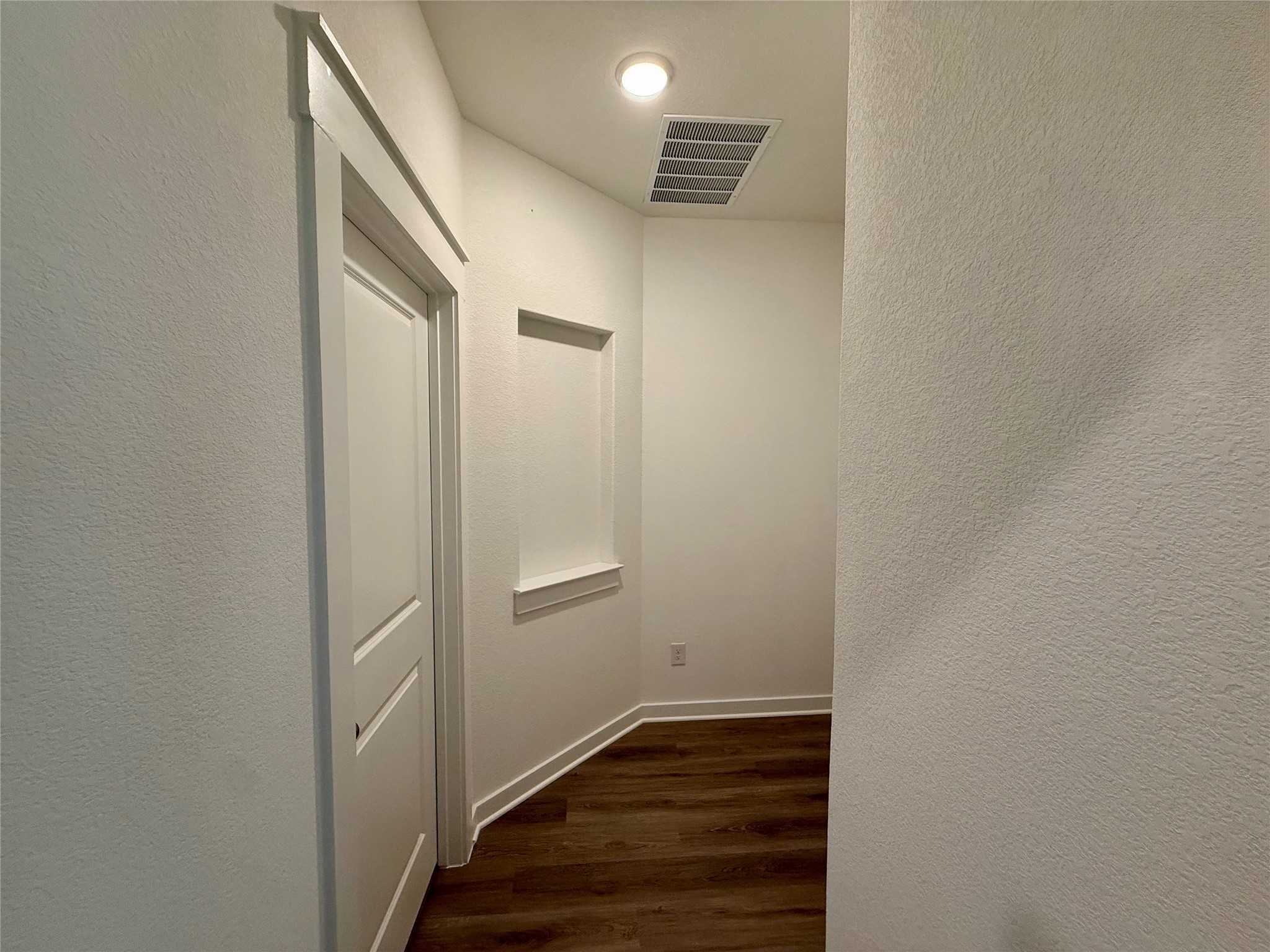 13605 Barn Chime Street Elgin, TX 78621 - Photo 14 of 20 a view of a hallway with wooden floor