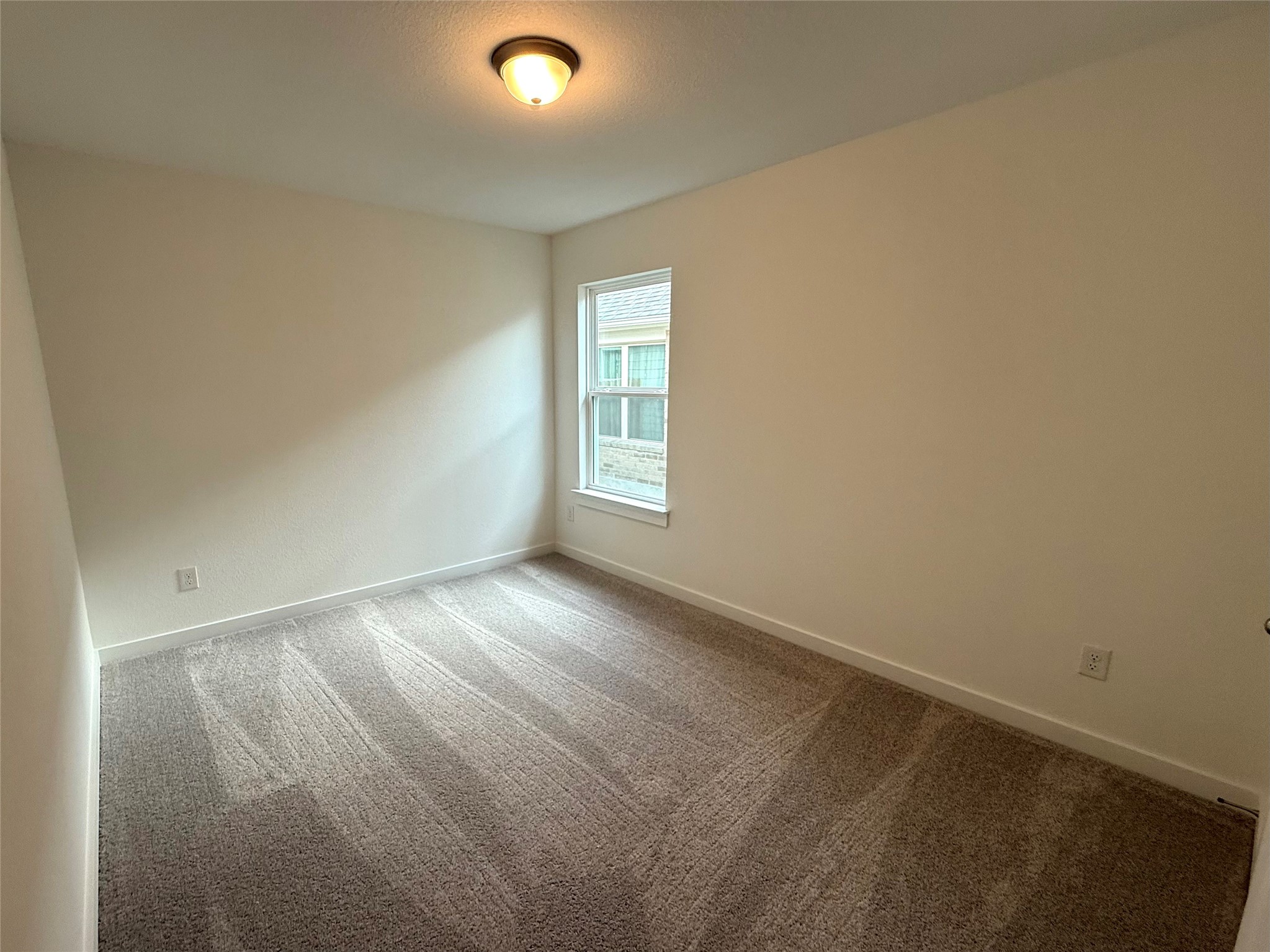 13605 Barn Chime Street Elgin, TX 78621 - Photo 15 of 20 an empty room with windows