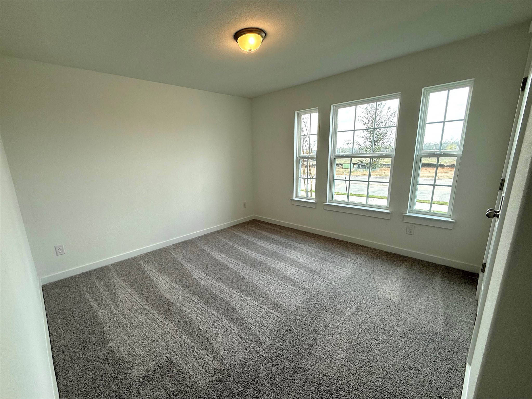 13605 Barn Chime Street Elgin, TX 78621 - Photo 16 of 20 an empty room with a window