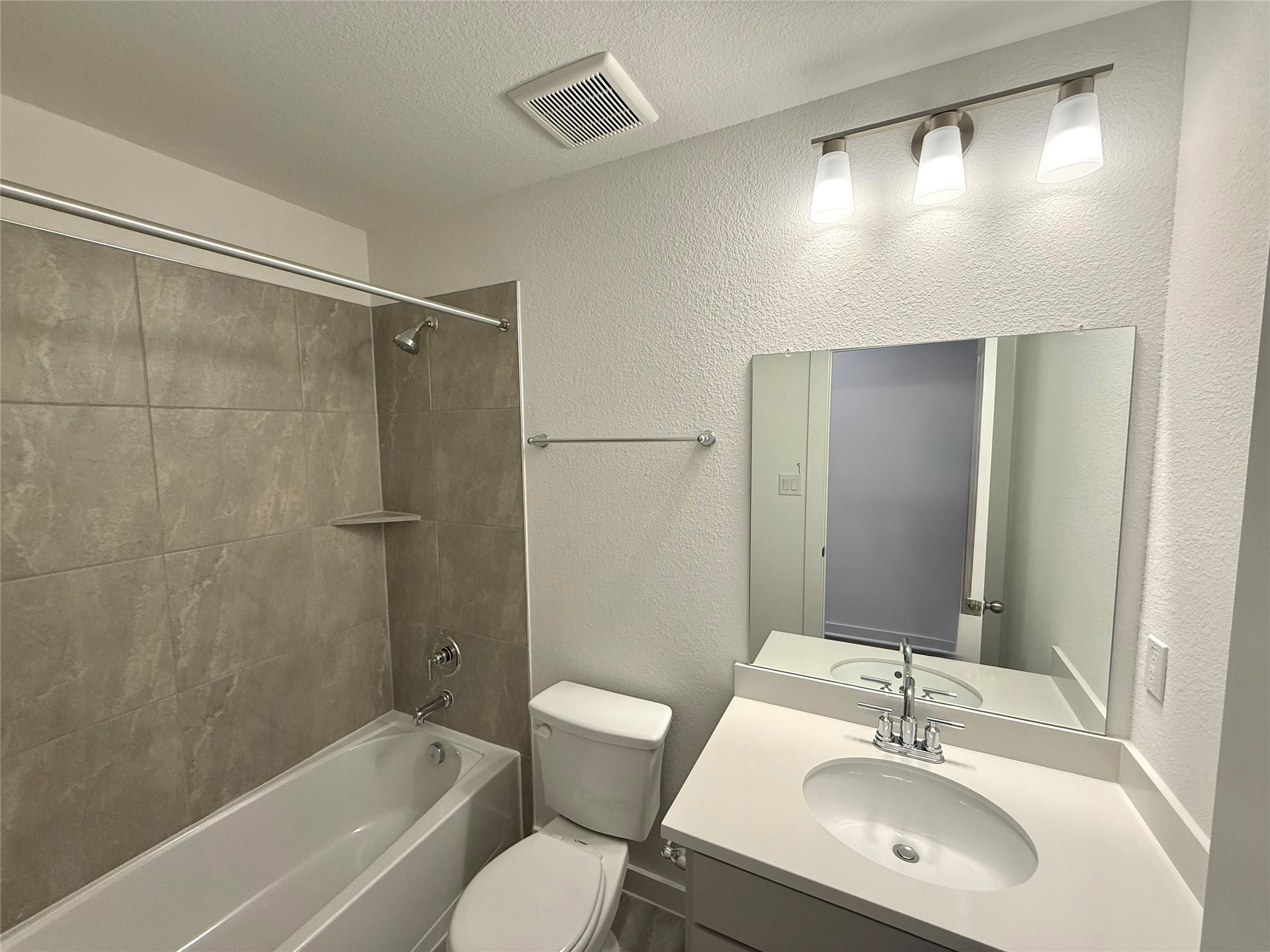 13605 Barn Chime Street Elgin, TX 78621 - Photo 17 of 20 a bathroom with a sink toilet and shower