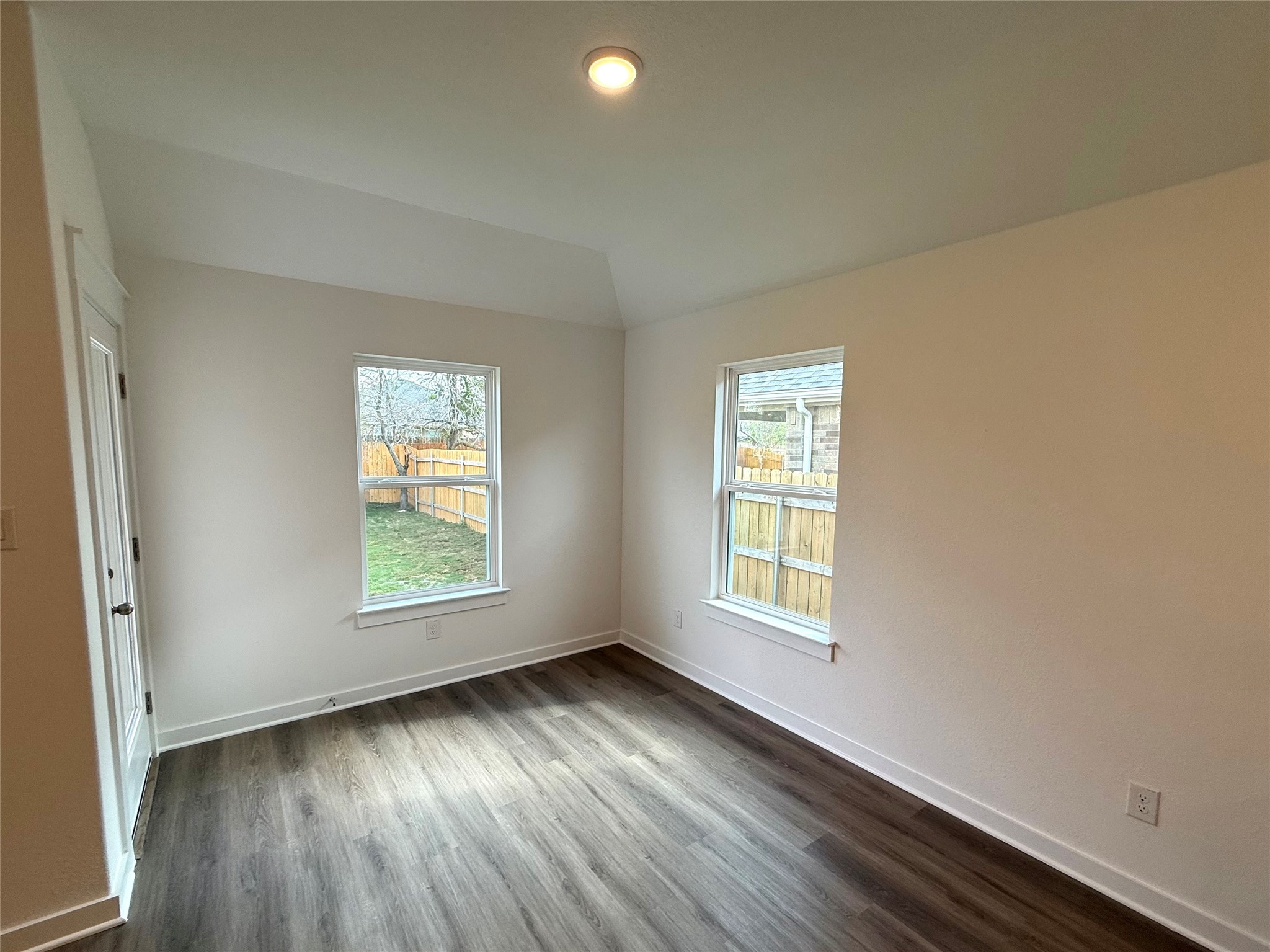 13605 Barn Chime Street Elgin, TX 78621 - Photo 7 of 20 an empty room with wooden floor and windows