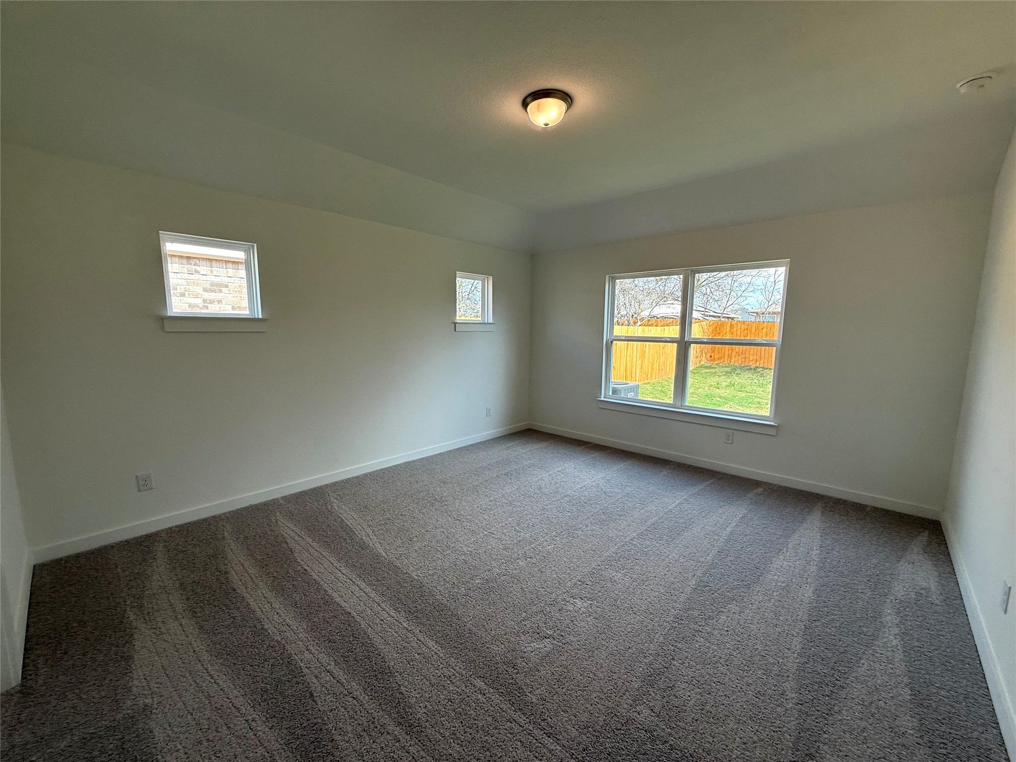 13605 Barn Chime Street Elgin, TX 78621 - Photo 9 of 20 an empty room with a window