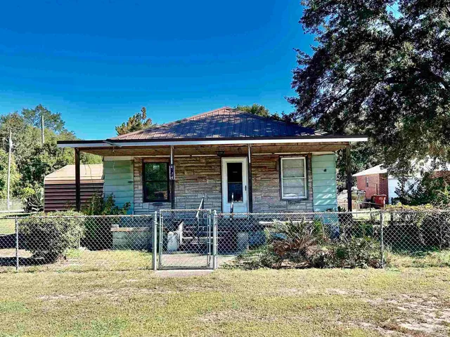 a view of a chair and table in the patio