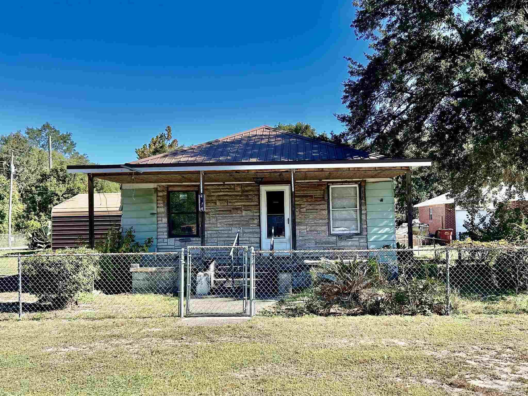 a view of a chair and table in the patio