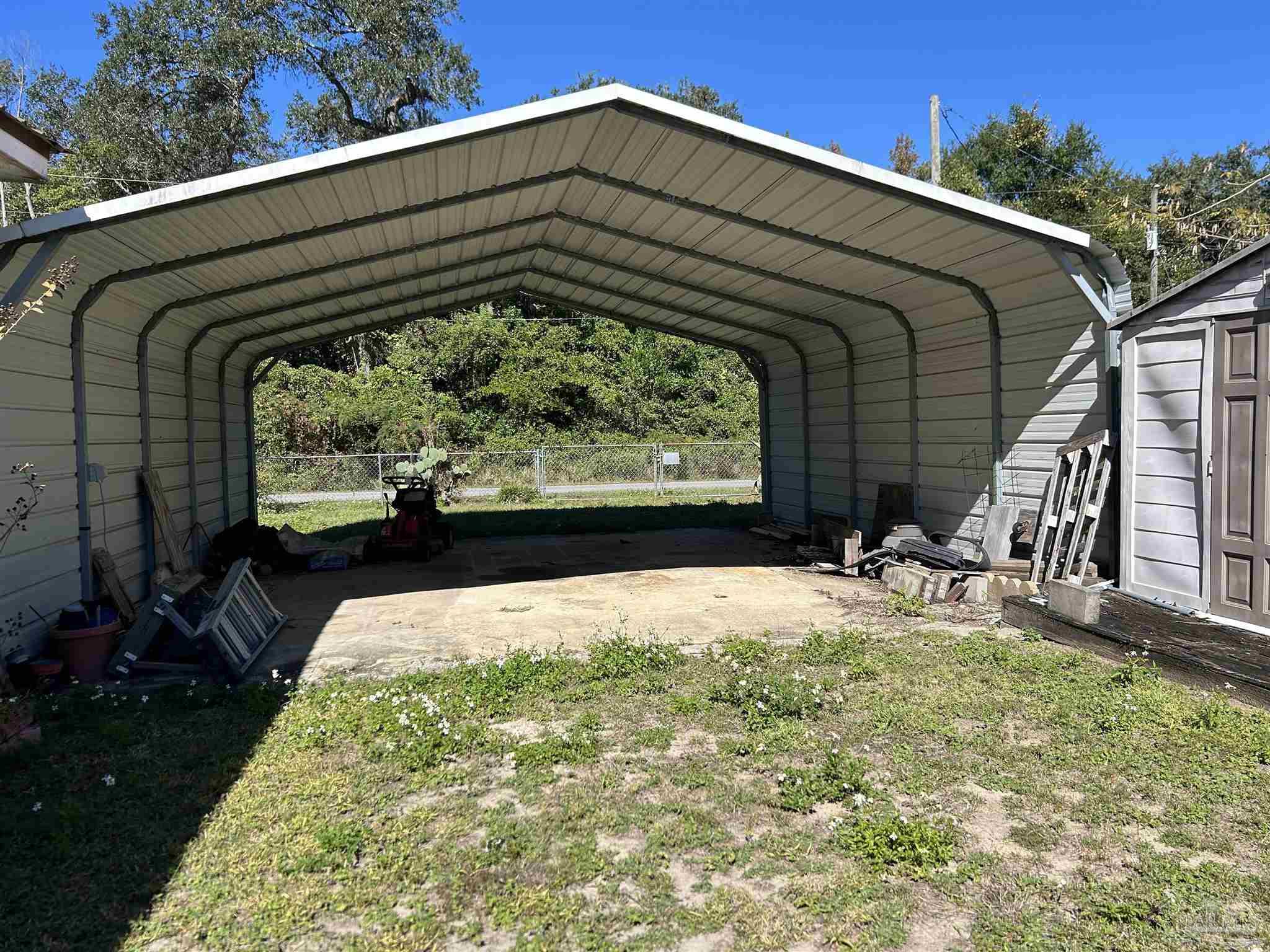 4574 Simpson Street Milton, FL 32583 - Photo 2 of 7 a front view of house with garden