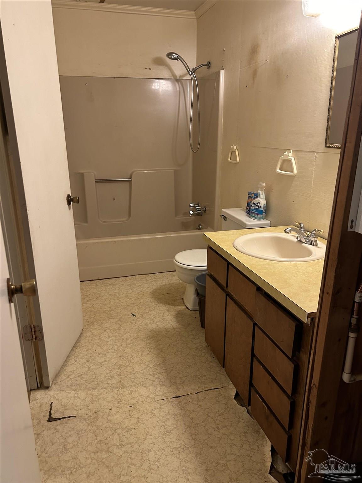 4574 Simpson Street Milton, FL 32583 - Photo 6 of 7 a bathroom with a sink a toilet and shower