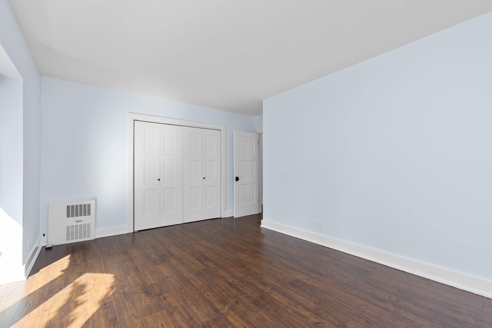 2300 Windsor Mall, Unit 2E Park Ridge, IL 60068 - Photo 15 of 27 a view of an empty room with wooden floor