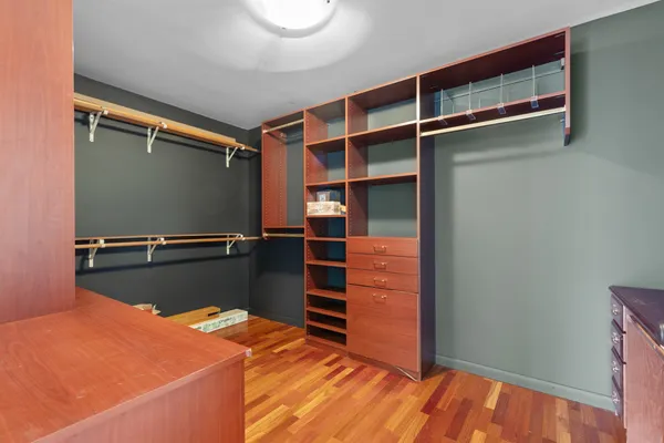 a room with closet and wooden floor