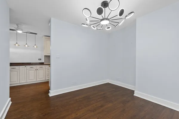 a view of kitchen with wooden floor