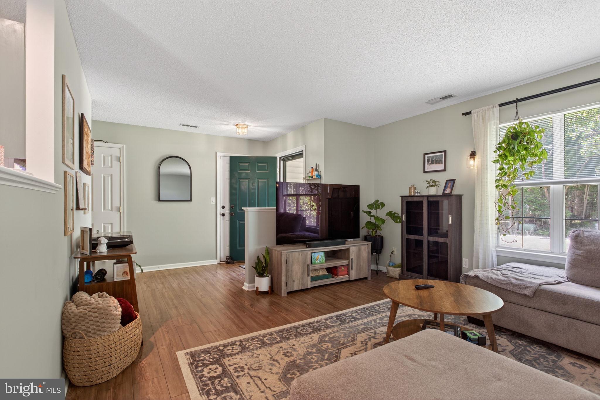 3917 Longhill Station Road Williamsburg, VA 23188 - Photo 5 of 29 Inviting living space with natural light.