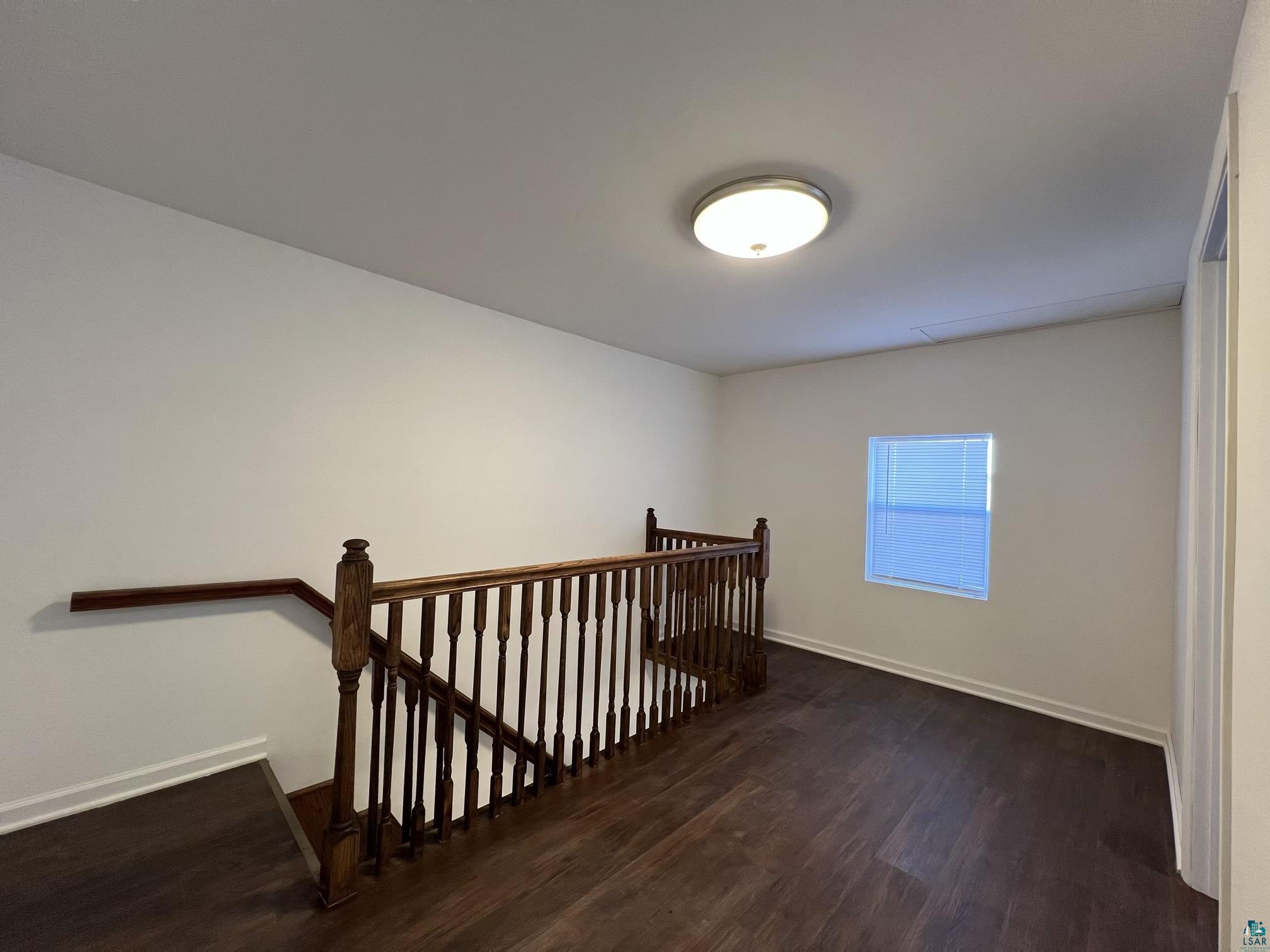 306 7th Street West Ashland, WI 54806 - Photo 15 of 25 Stairs featuring wood finished floors and baseboards