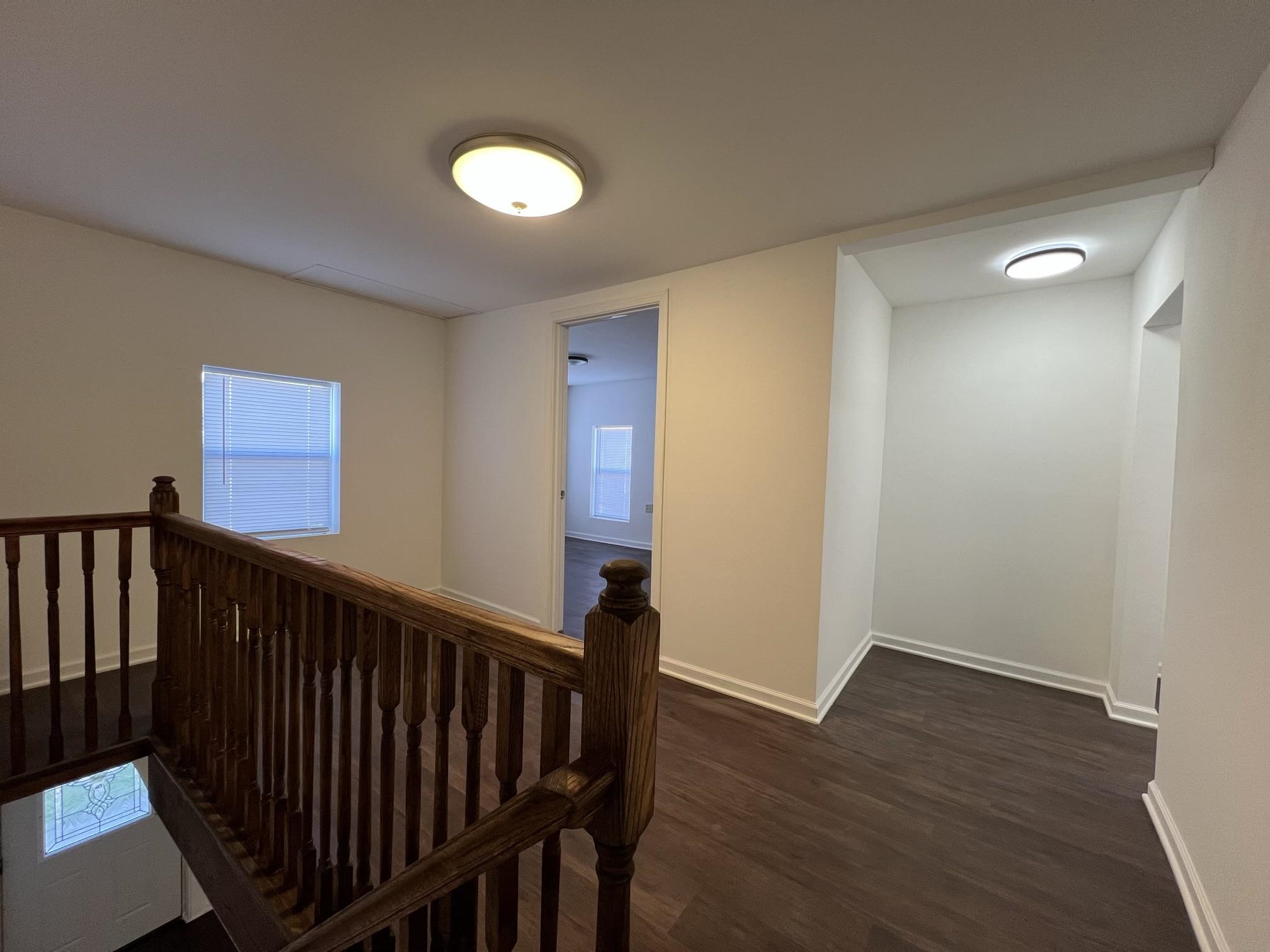 306 7th Street West Ashland, WI 54806 - Photo 16 of 25 Hallway featuring an upstairs landing and dark wood-style floors