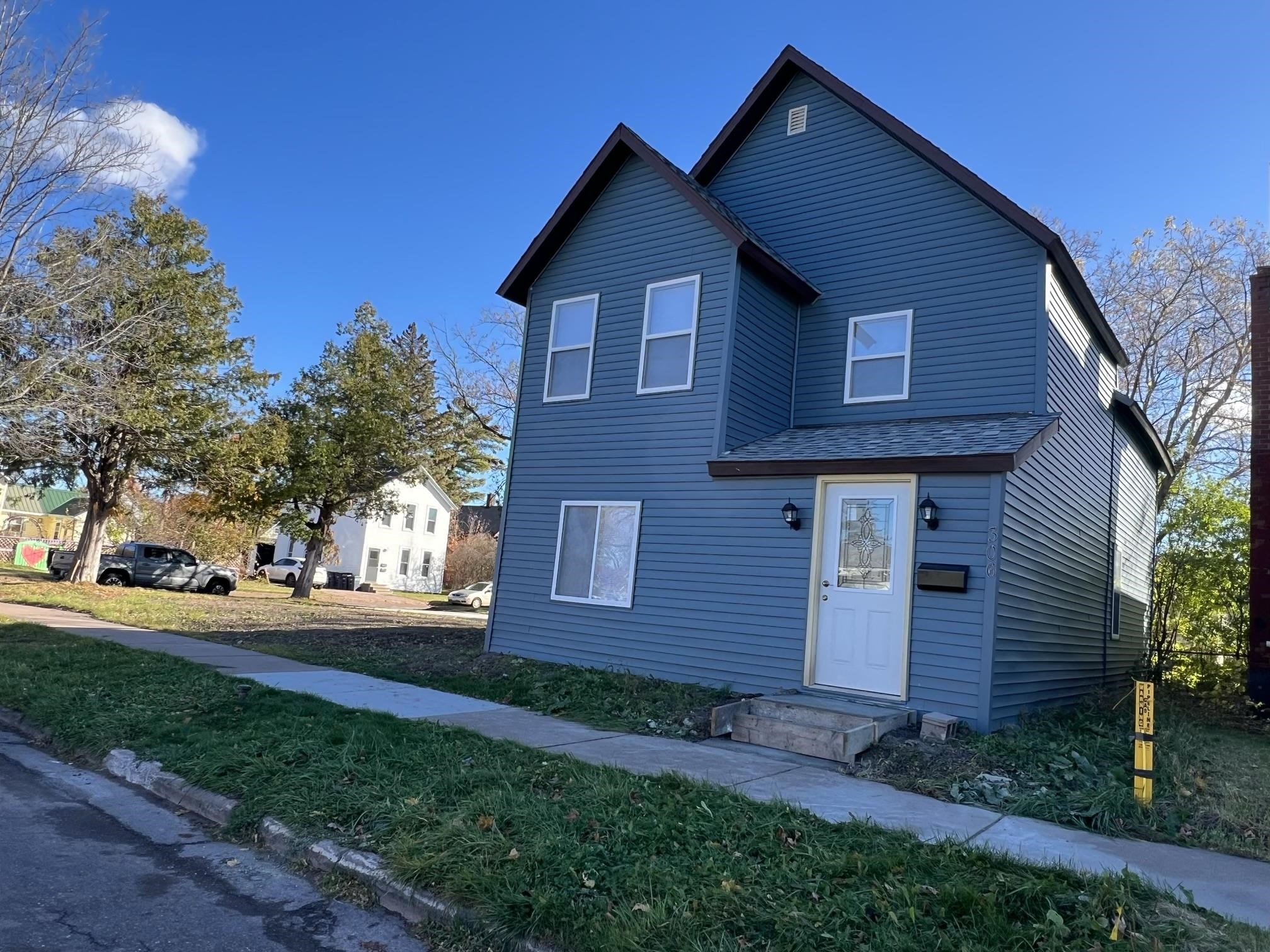 306 7th Street West Ashland, WI 54806 - Photo 25 of 25 Traditional home with a front lawn and roof with shingles