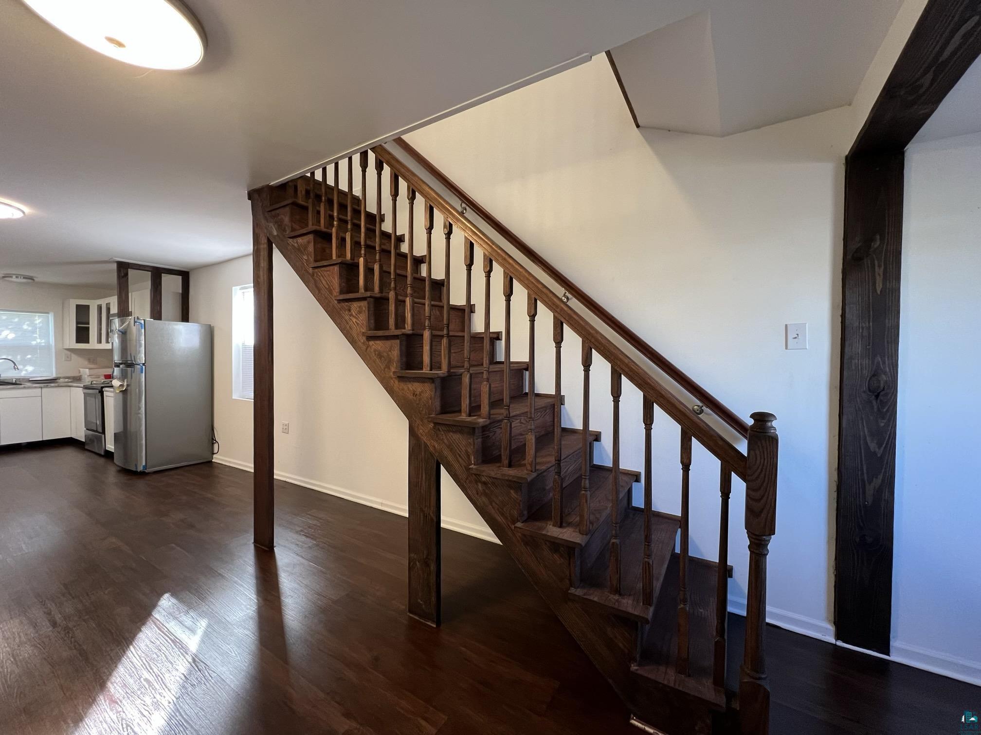 306 7th Street West Ashland, WI 54806 - Photo 6 of 25 Stairs featuring wood finished floors and baseboards