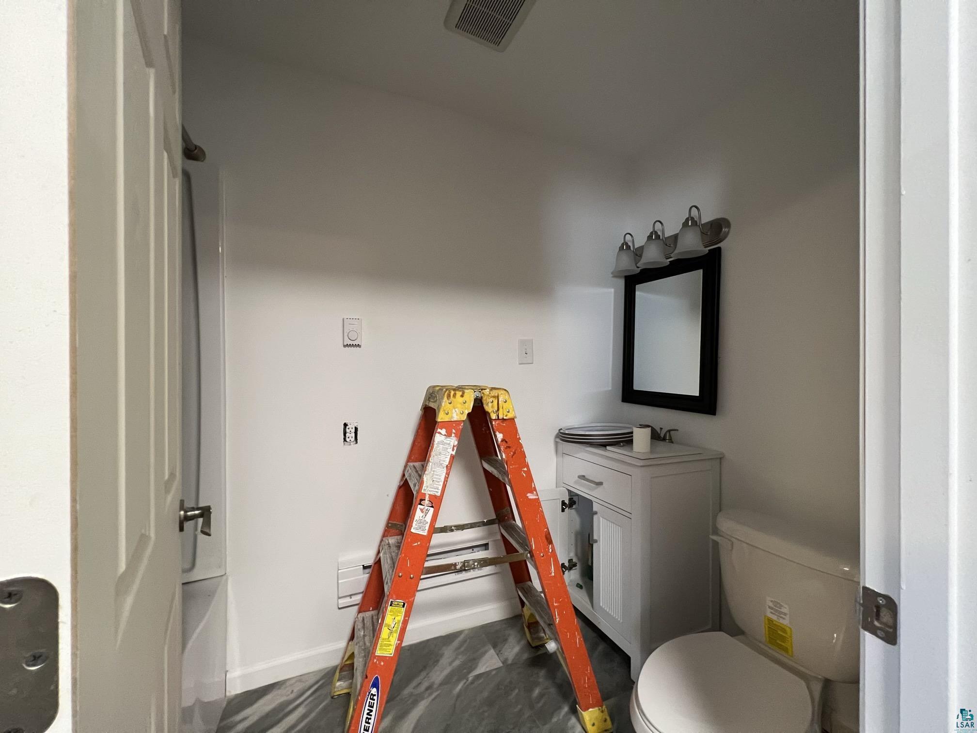 306 7th Street West Ashland, WI 54806 - Photo 9 of 25 Bathroom with toilet and vanity