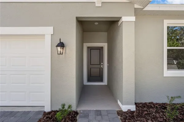 a room with a door open to a room