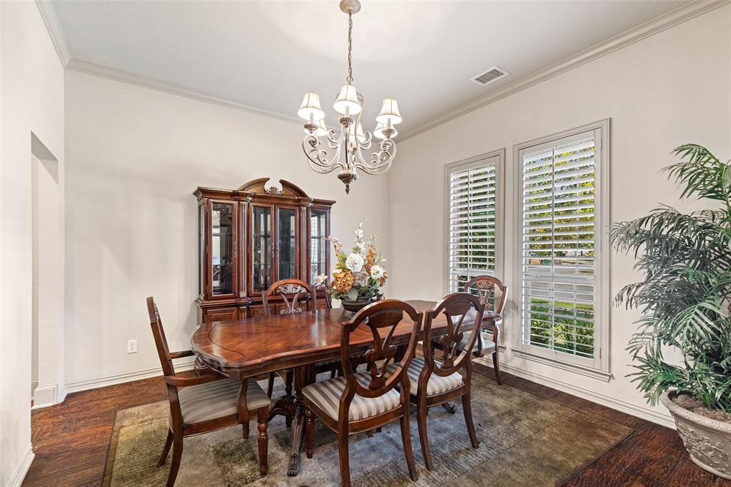 1217 Windmere Way Allen, TX 75013 - Photo 10 of 38 Bathed in natural light, the formal dining room offers an elegant backdrop for holiday gatherings and intimate dinners alike.