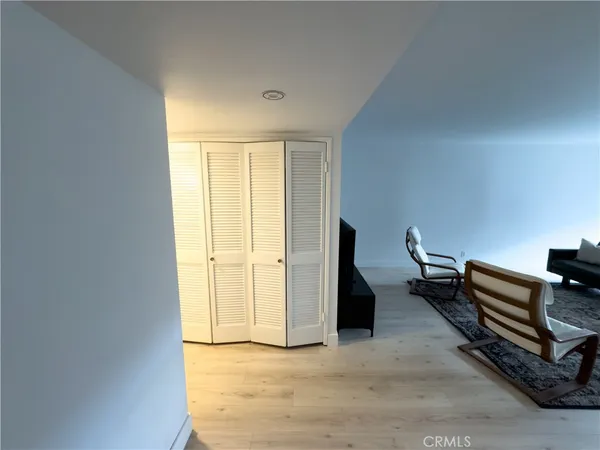 a view of workspace with wooden floor and windows