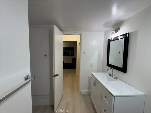 a bathroom with a double vanity sink and mirror