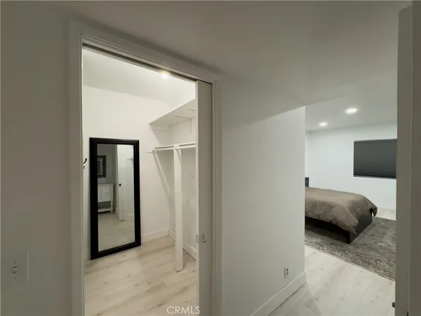 a bedroom with a bed and a view of bedroom