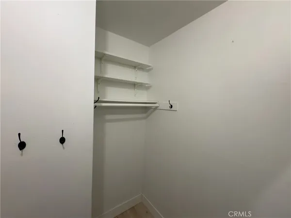 a view of a room with racks on the wall