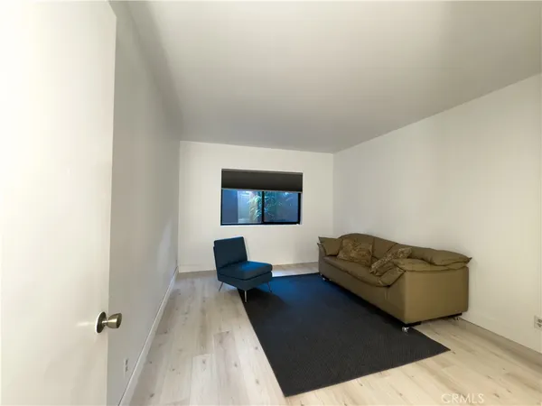 a living room with a couch and a window