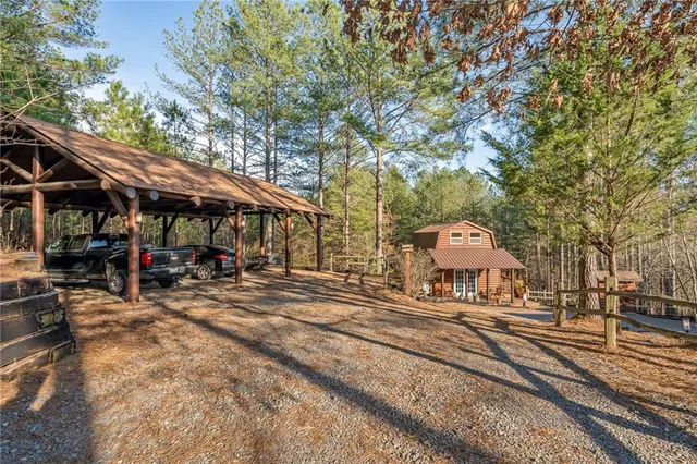 a bathroom with a granite countertop sink a mirror and shower