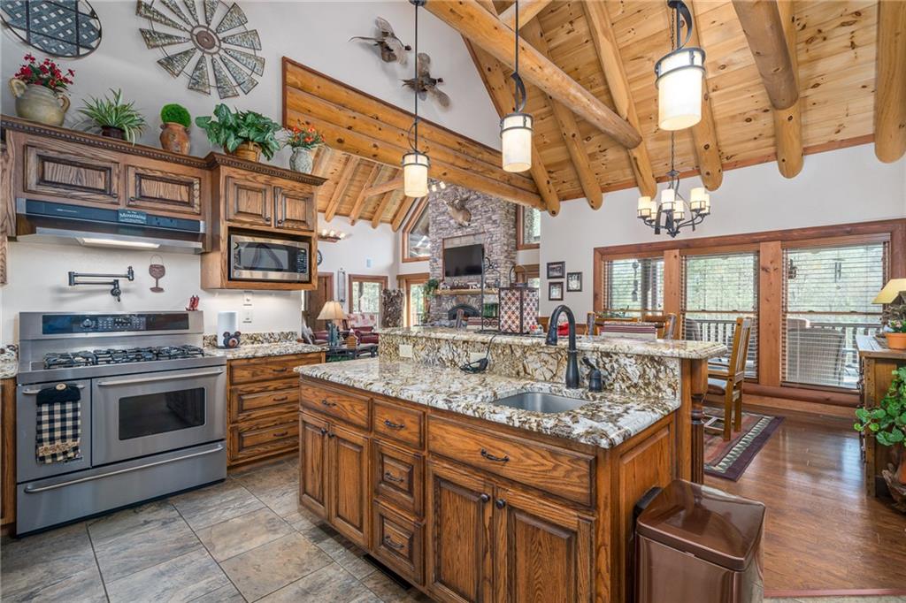 415 Kestrel Rdg Circle Murphy, NC 28906 - Photo 41 of 104 a kitchen with stainless steel appliances granite countertop a stove and a sink
