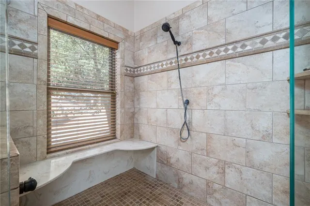a view of a chairs and table in patio with wooden floor