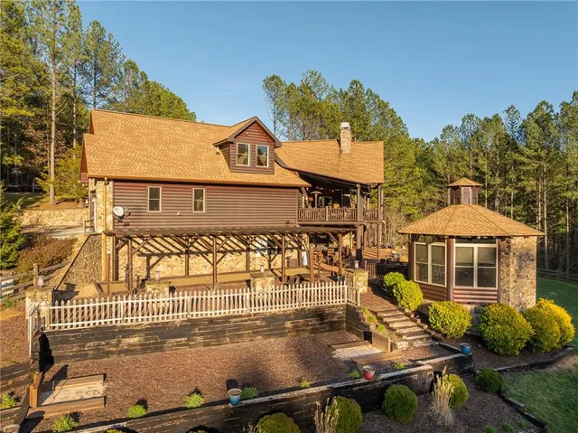 a aerial view of a house with yard swimming pool and outdoor seating