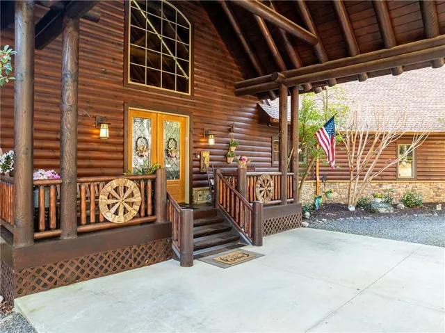 a view of a house with a yard and roof