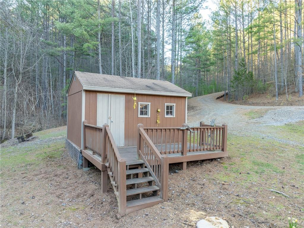 415 Kestrel Rdg Circle Murphy, NC 28906 - Photo 85 of 104 a view of a roof deck with wooden fence and a bench