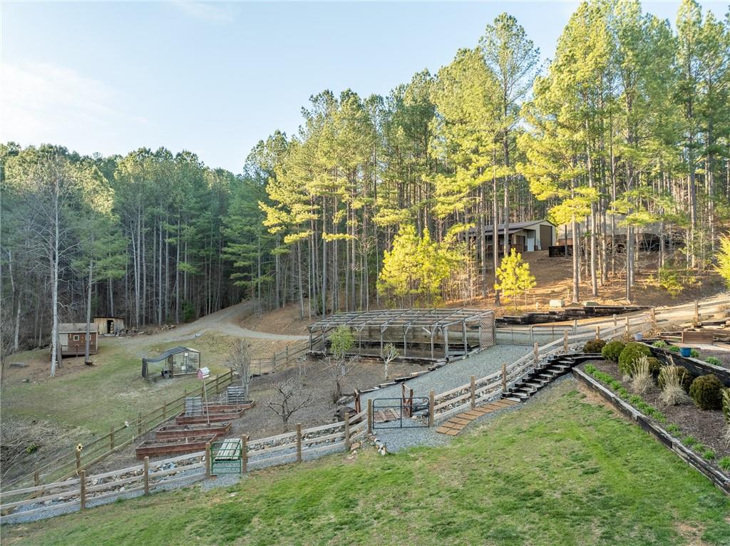 415 Kestrel Rdg Circle Murphy, NC 28906 - Photo 88 of 104 a backyard of a house with barbeque oven table and chairs