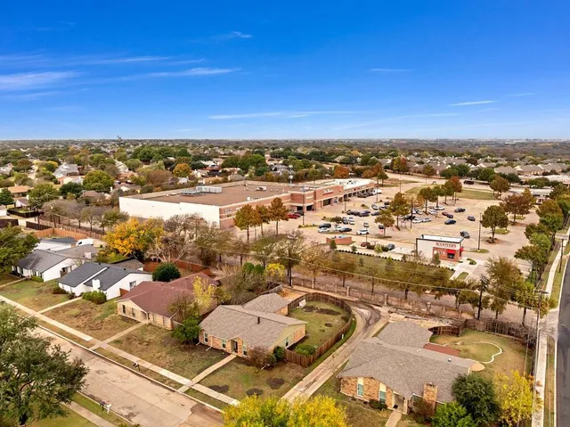 an aerial view of residential houses with outdoor space
