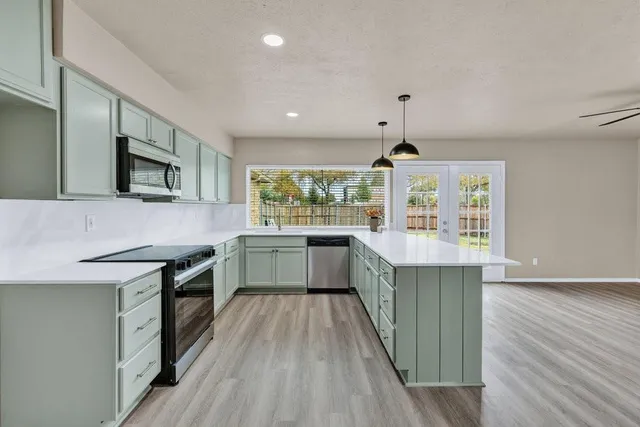 a kitchen with a stove and a sink