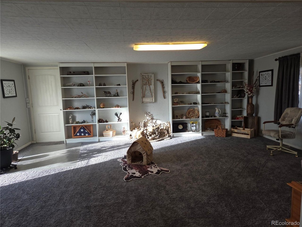 15296 39th Road Sterling, CO 80751 - Photo 15 of 31 a room with furniture and gym equipment