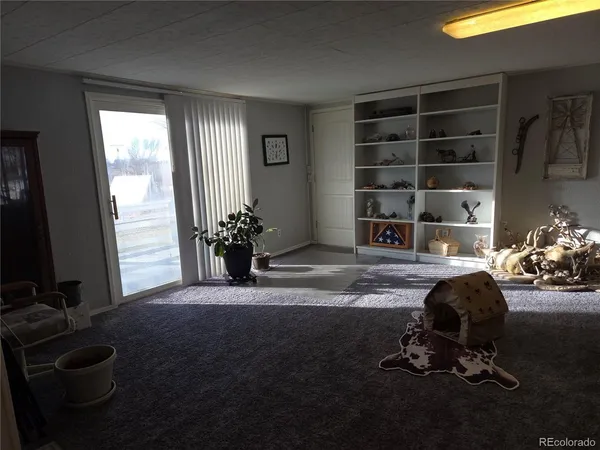 a room with furniture and a flat screen tv