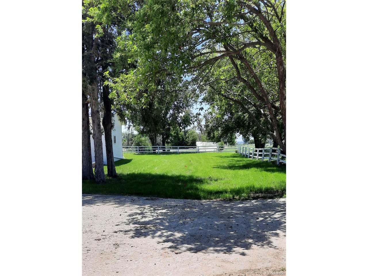 15296 39th Road Sterling, CO 80751 - Photo 2 of 31 a view of a park with large trees
