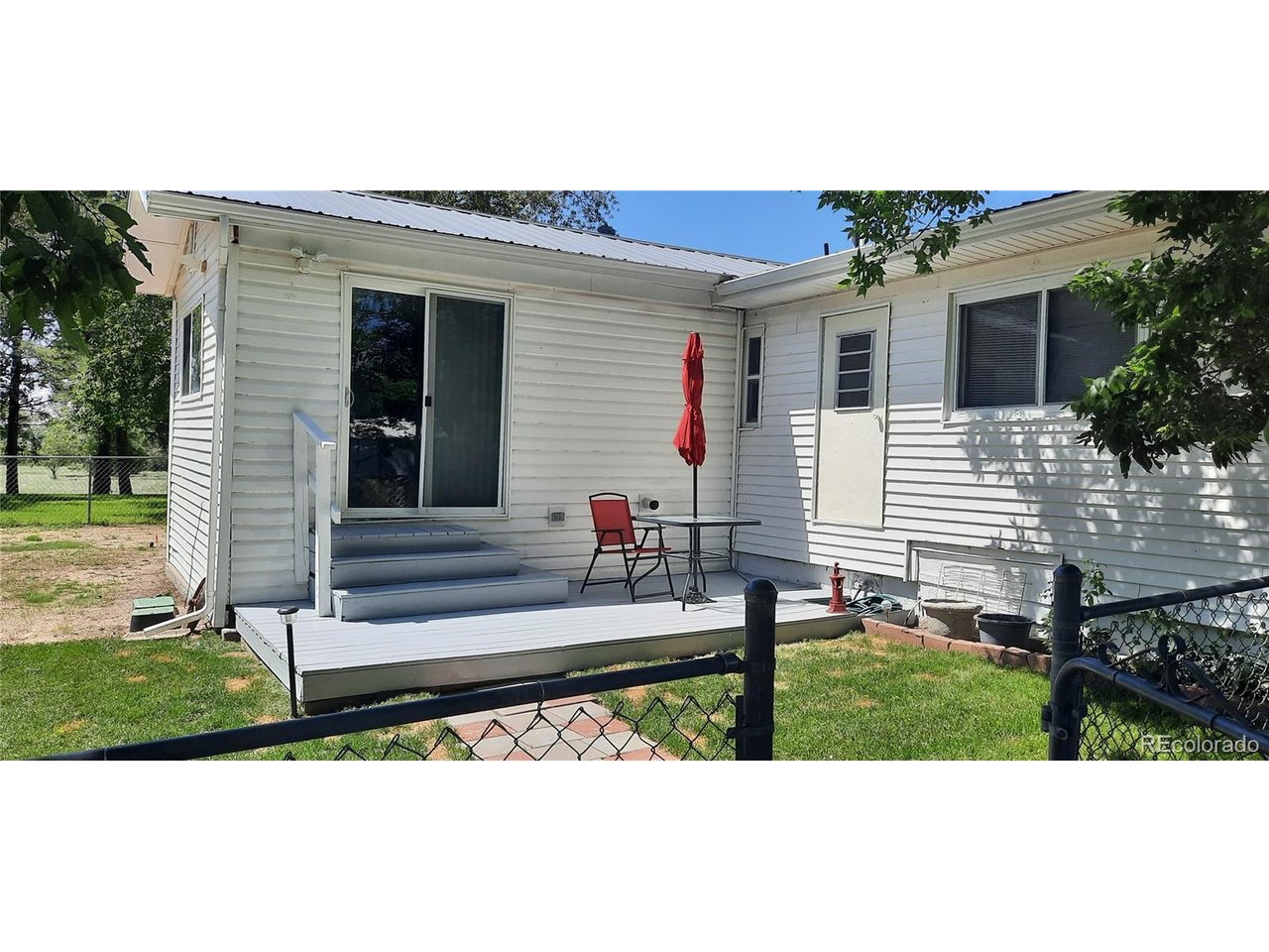 15296 39th Road Sterling, CO 80751 - Photo 5 of 31 a view of a house with backyard and sitting area