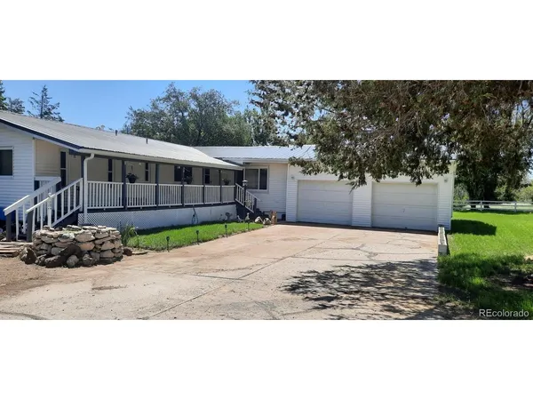 a view of a backyard of the house