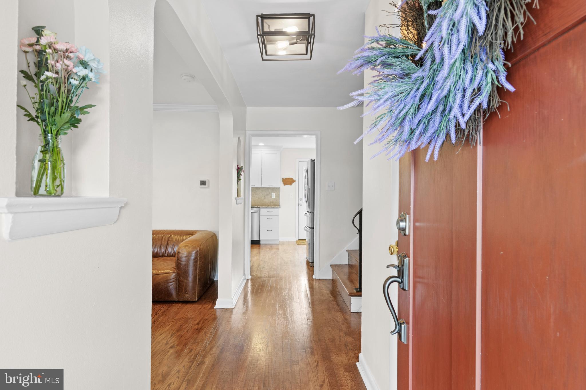 502 Ridge Avenue Kennett Square, PA 19348 - Photo 12 of 60 a view of hallway with livingroom and wooden floor